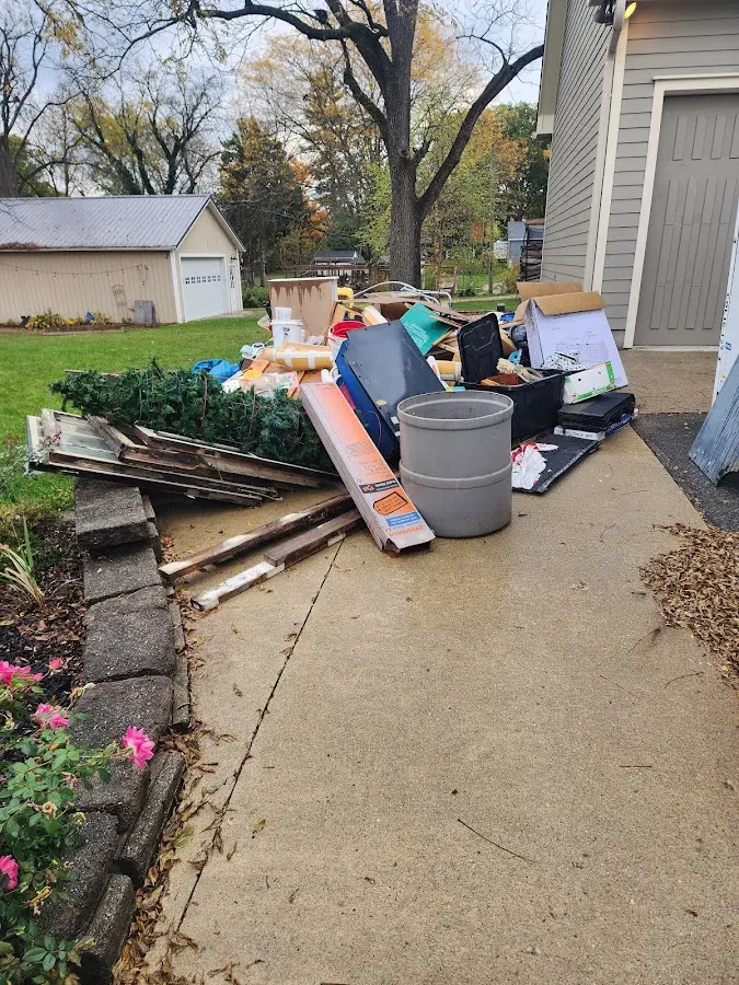Dumpster being loaded with debris for Residential Dumpster Rental in Menifee